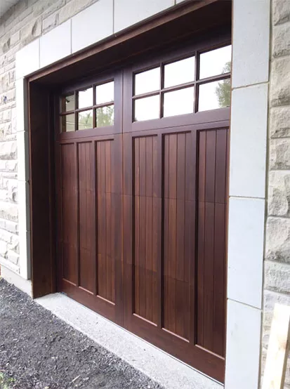Wooden garage door with moulding and windows, in real maple, Cedar colour, sold and installed by Portes Domac in Gatineau.
