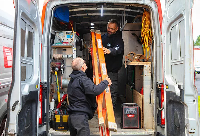 Domac installers filling a truck for garage door repair and garage door installation in Gatineau